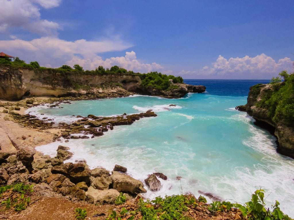 turquoise sea below rocks in Bali