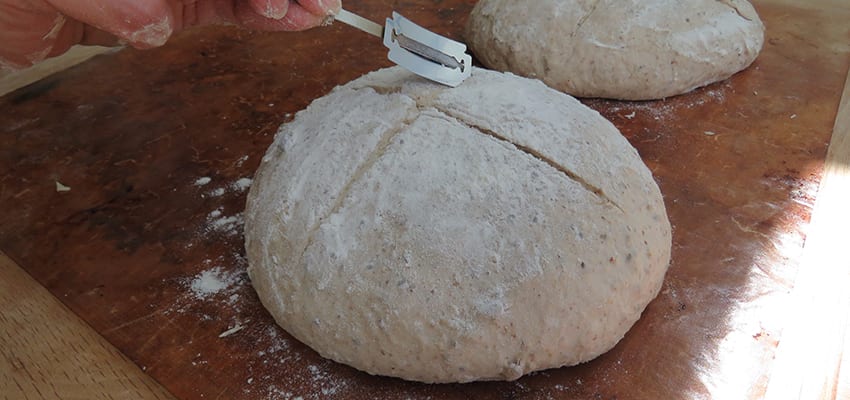 Using a Lame to score the multiseed dough