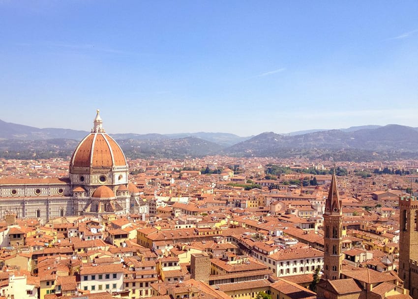 The terracotta rooves of Florence with the Duomo and the hills in the background