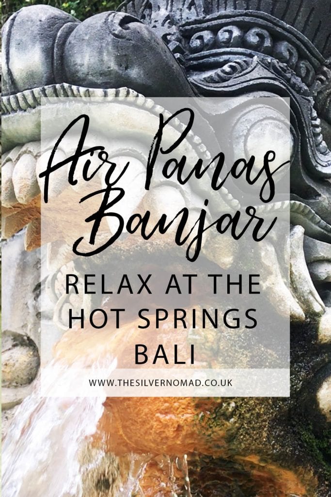 Air Panas Banjar relax at the Hot Springs Bali with stone-carved nagas (mythical dragons) spouting sulphur water