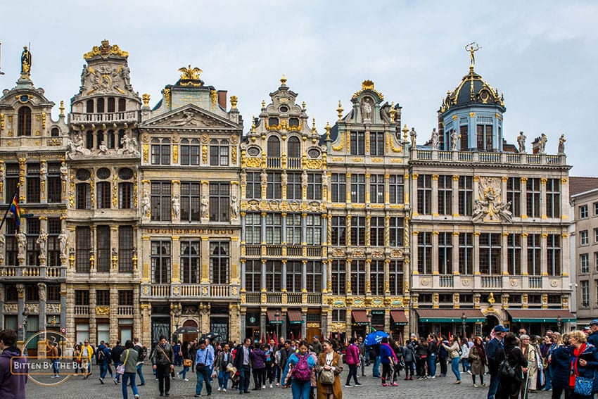 The Grand Place in Brussels showing the tall highly decorated buildings around the place