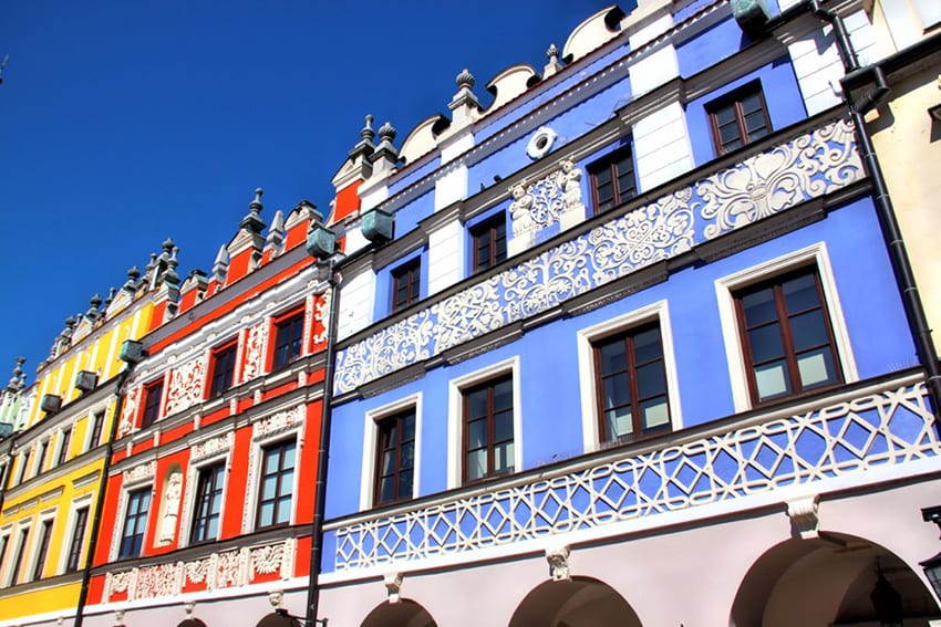 Colourful Tenemnet houses in Zamosc Poland with blue, red and yellow painted facades