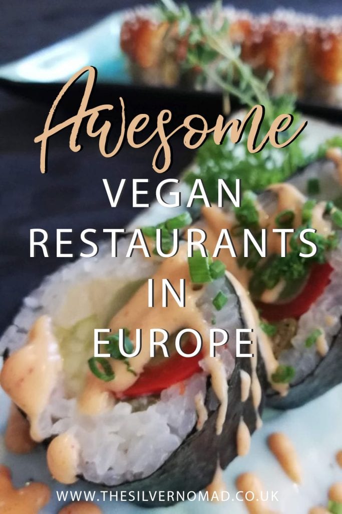 Vegan sushi in black nori sheets with white rice and red pepper and green avocado with a peach coloured dressing. Writing "Awesome vegan restaurants in Europe" superimposed on top
