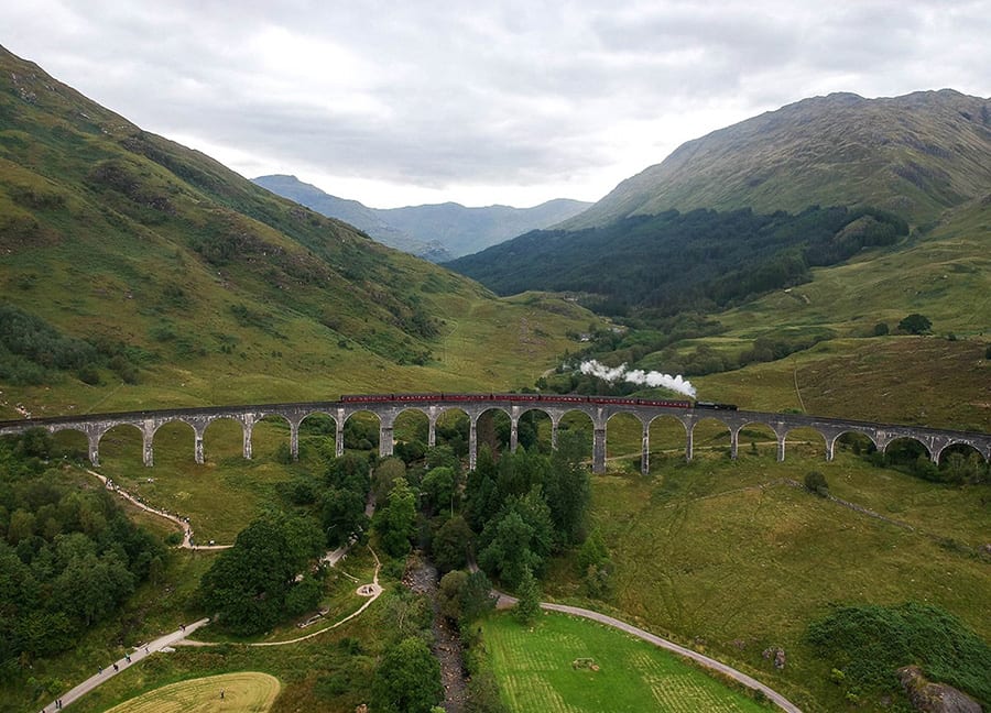 Train Crossing Glenfinnan Viaduct Harry Potter Bridge on Scotland Road Trip