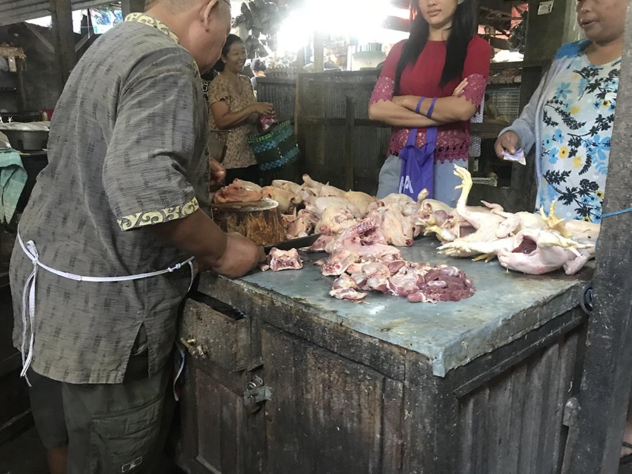 buying chicken at the market