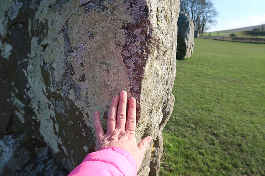 You can touch the stones at Avebury