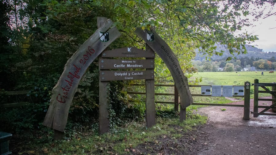 wooden arched and signboard at the entrance to Castle Meadows