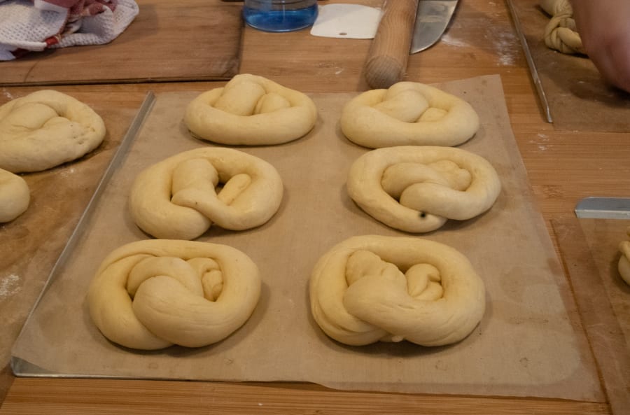 dough twisted into pretzel shapes ready for baking
