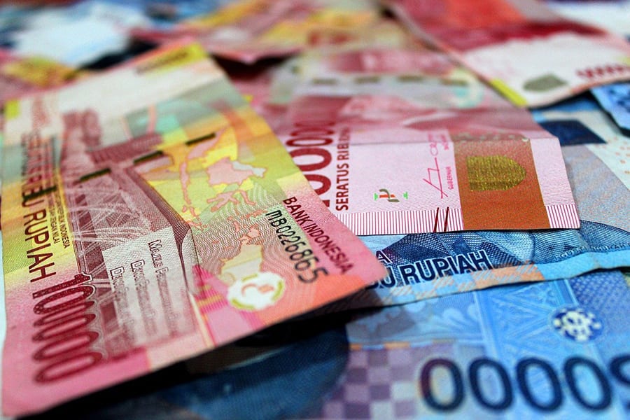 red and blue bank Rupiah notes from Indonesia