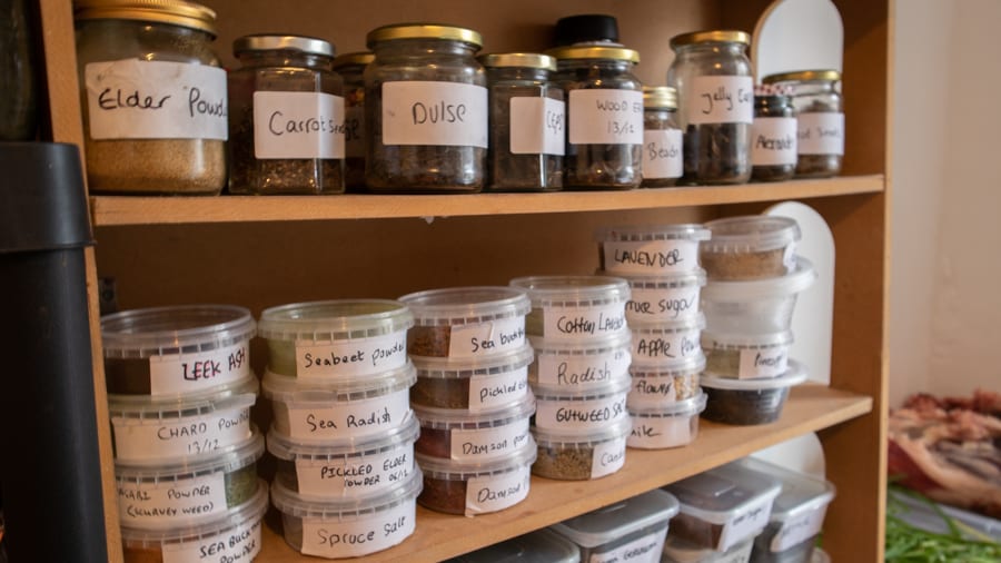shelves with jars of dried ingredients