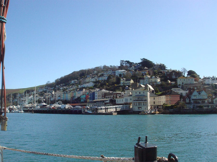 the water in the foreground with the coloured houses of Kingswear