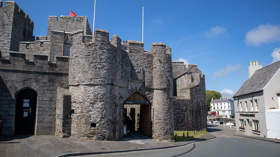arched entrance to the 13th Century Castle Rushen with crenelations on the walls