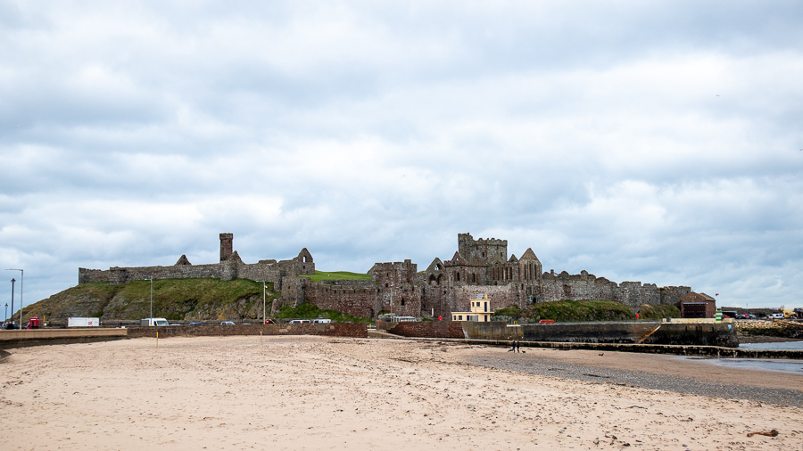 Peel Castle in the distance with sandy beach in front