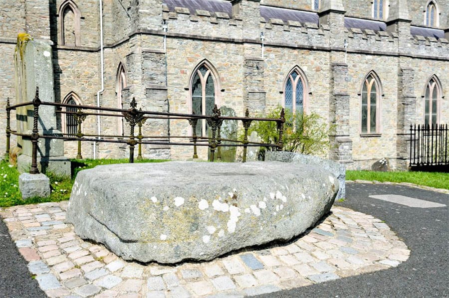 Saint Patrick's grave at Down Cathedral sitting on small paving