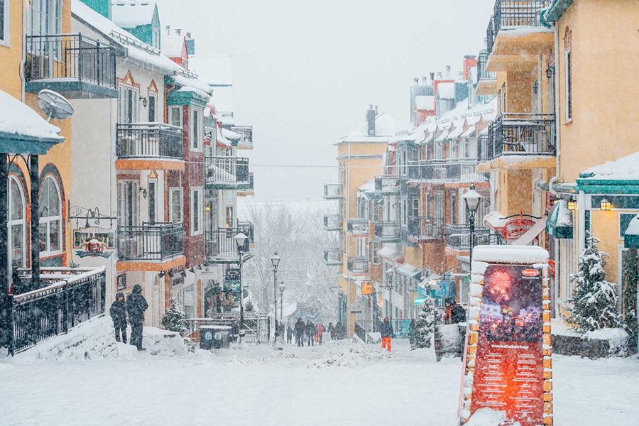 Mont Tremblant pedestrian village in Quebec Canada with snow coming down perfect place for winter snow
