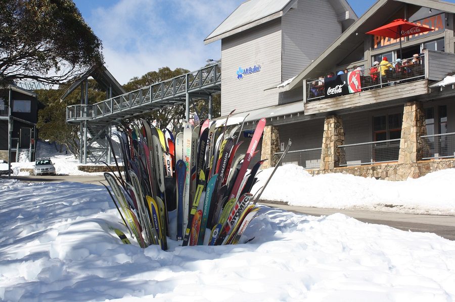 Mount Buller - skis sticking in the snow  outside a restaurant in Mount Buller, Victoria, Australia