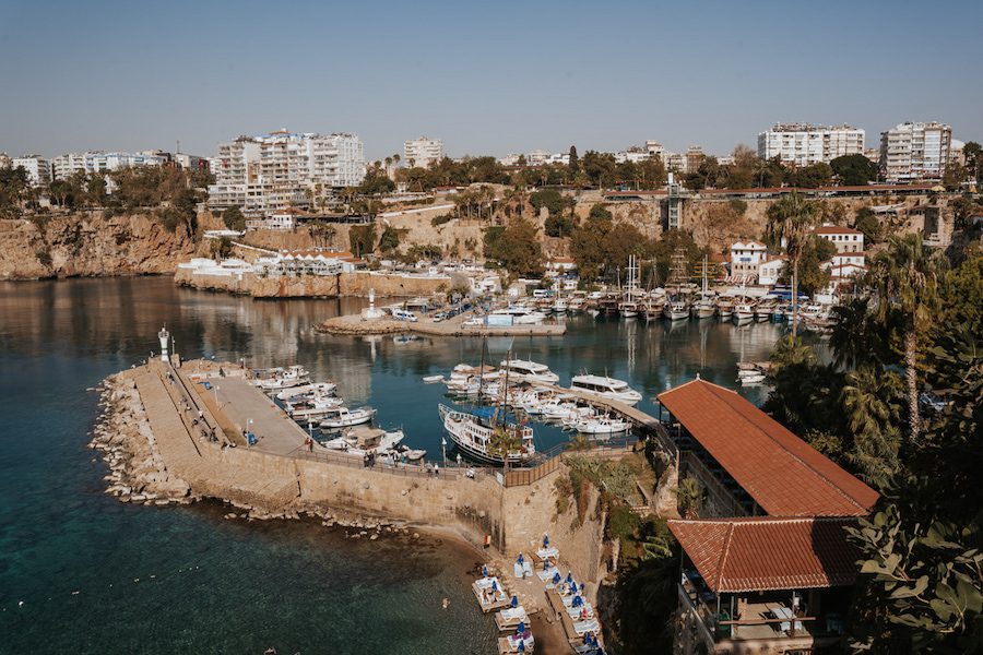 harbour at Antalya in Turkey with sail boats around the harbour and blocks of flats behind