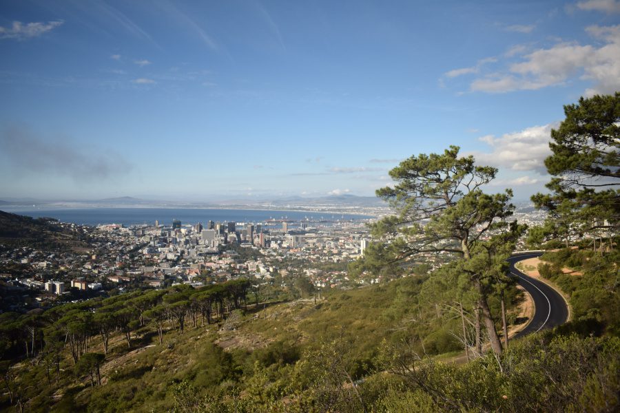 Cape Town City from the hills above with a winding road in the foreground