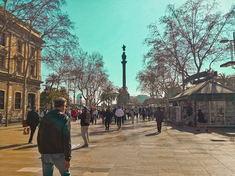 people walking in the Ramblas in Barcelona in the winter sun
