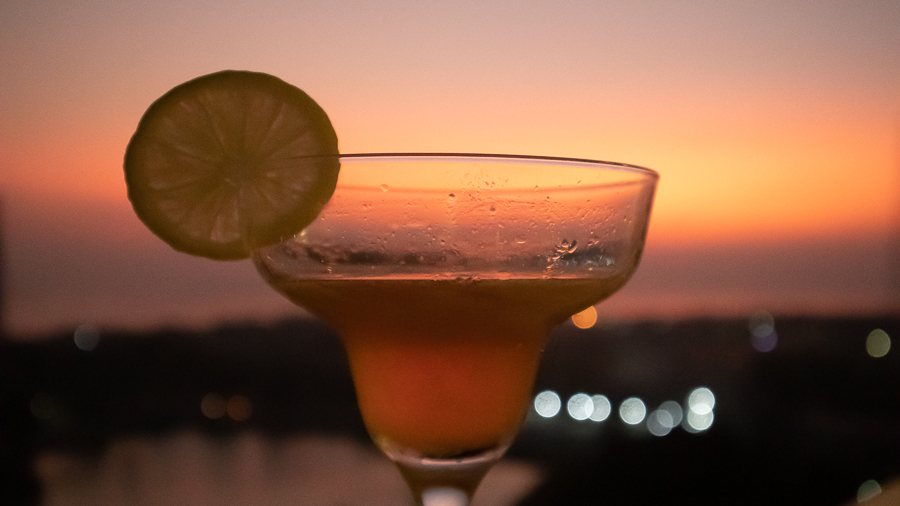 Jetwing Jaffna arrack cocktail against a sunset sky