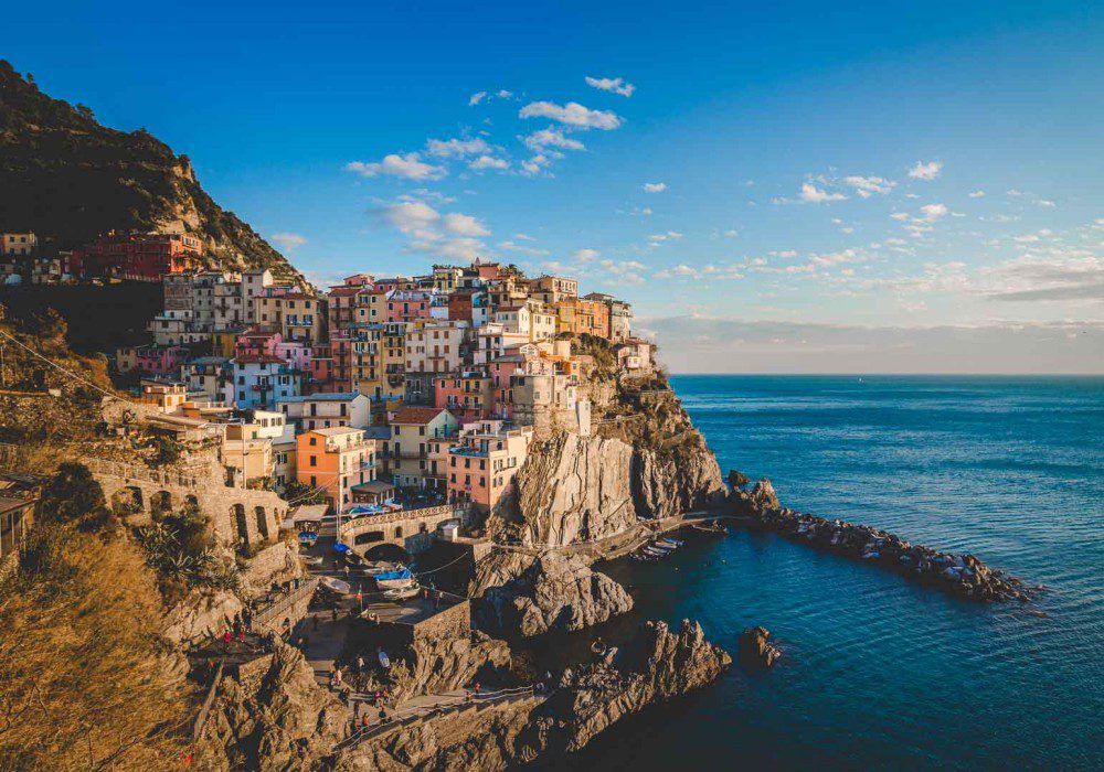 The multicoloured painted buildings of Cinque Terre above the bay and sea