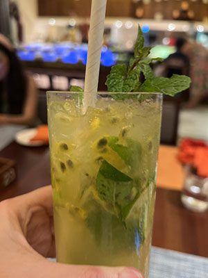 A refreshing green passion fruit drink with mint