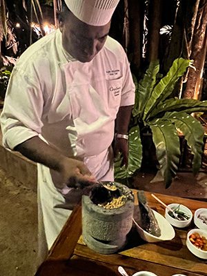 chef in whites showing off the sambol