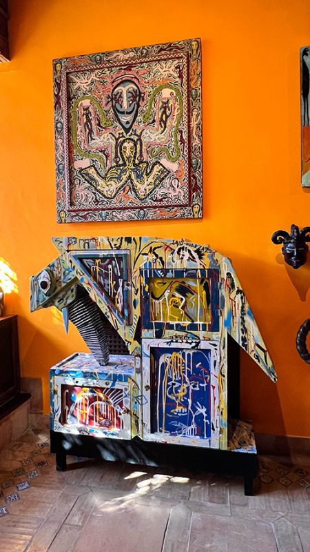 Some of the colourful objects in Sa Bassa Blanca Museum on an orange wall