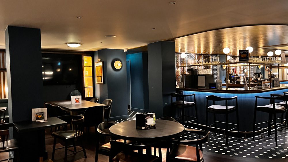 The Brassey Bar with blue and black furniture