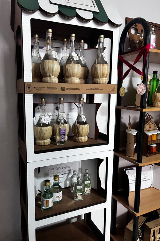 Floral Waters on display in carafes with straw bottoms