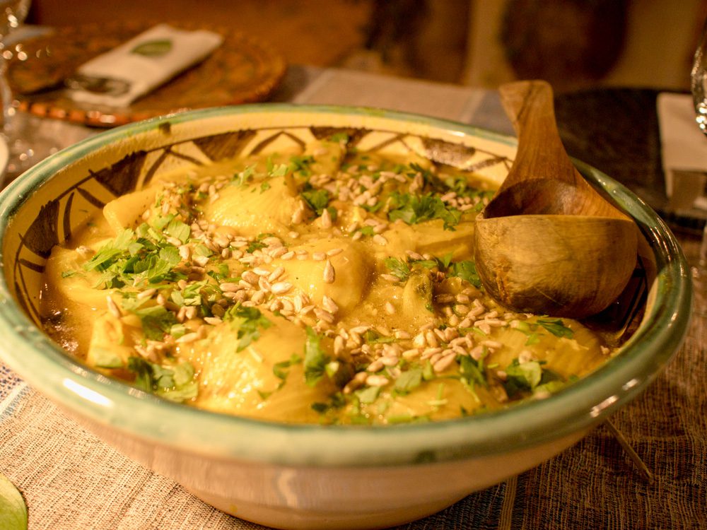 bowl of potatoes with coriander and sesame seeds