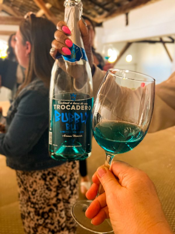 The blue Trocadero wine in the bottle and glass