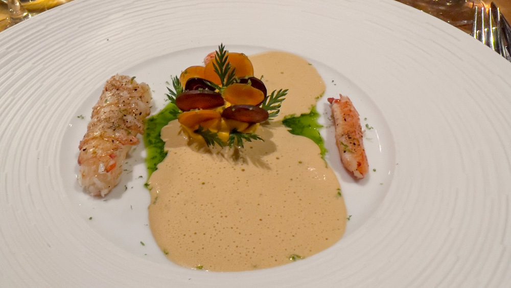 Langoustine tails with carrot slivers with langoustine foam