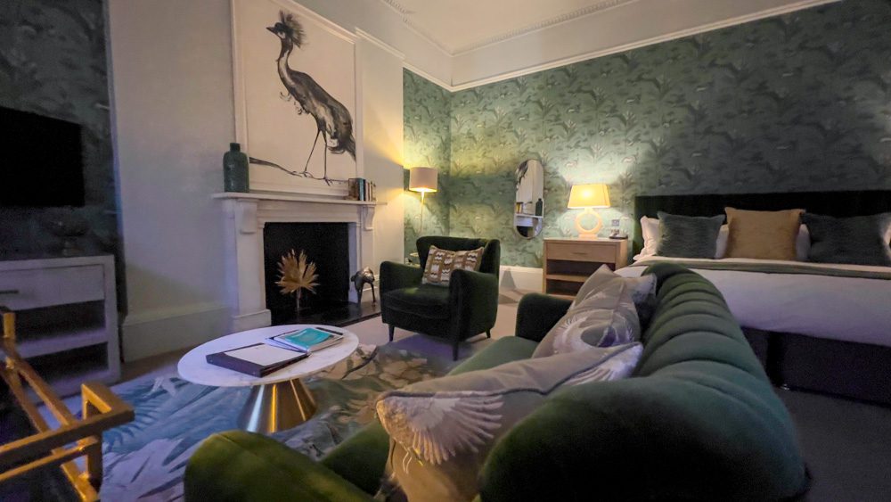 The green velvet sofa and arm chair