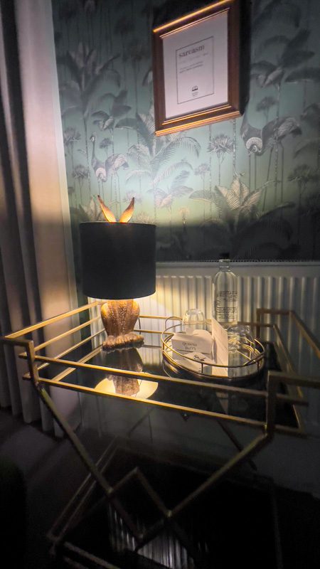 green lampshade with a gold hare's body underneath and ears sticking out