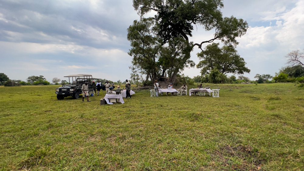 tables set up next to landrovers