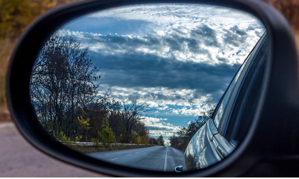 rear view of road in a wing mirror