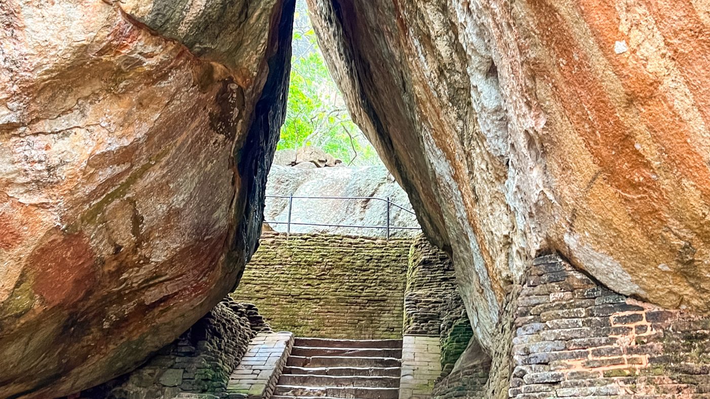 The Boulder Arch two boulders leaning in to each other with steps going up between them