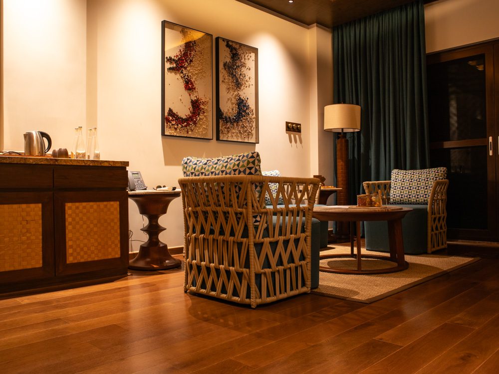 wicker chairs with blue seats and geometric pillows