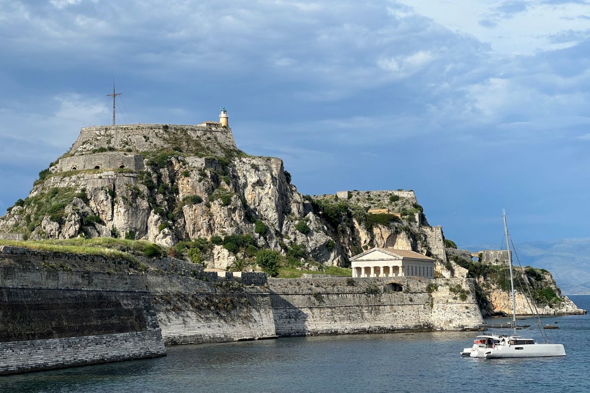 Island of Corfu with rock with a cross on the top