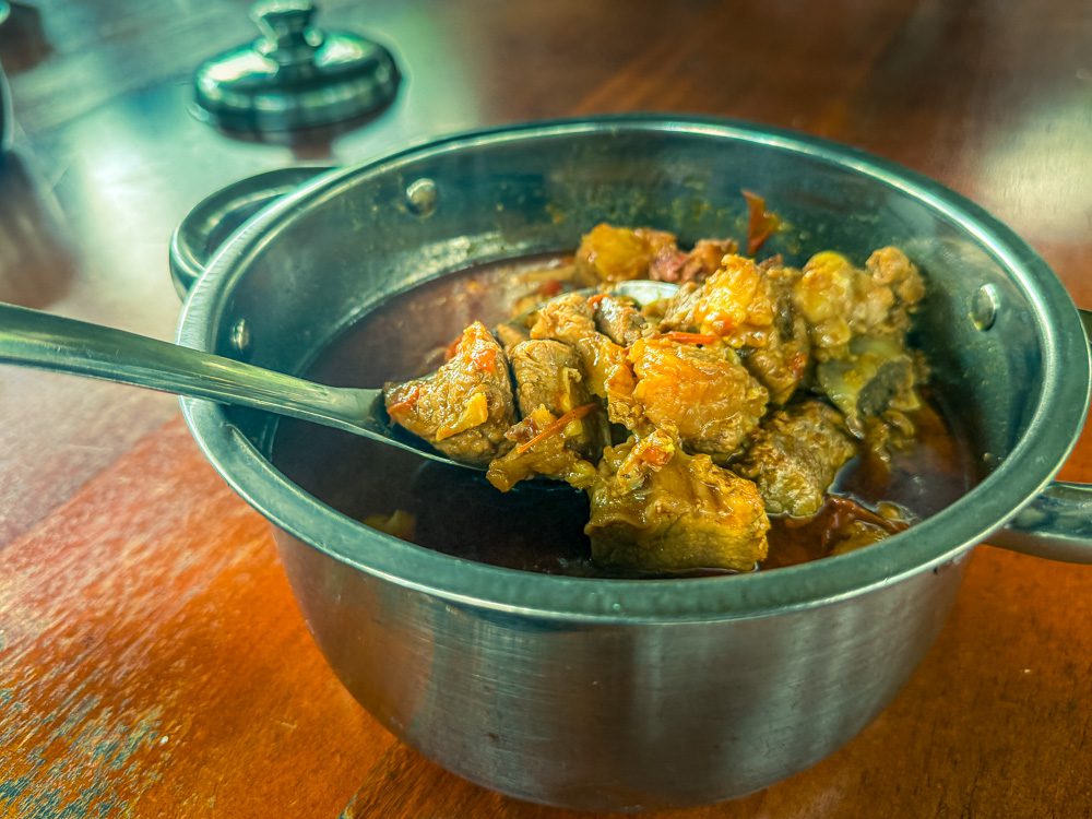 Fresh Beef Stew in a silver metal dish with spoon